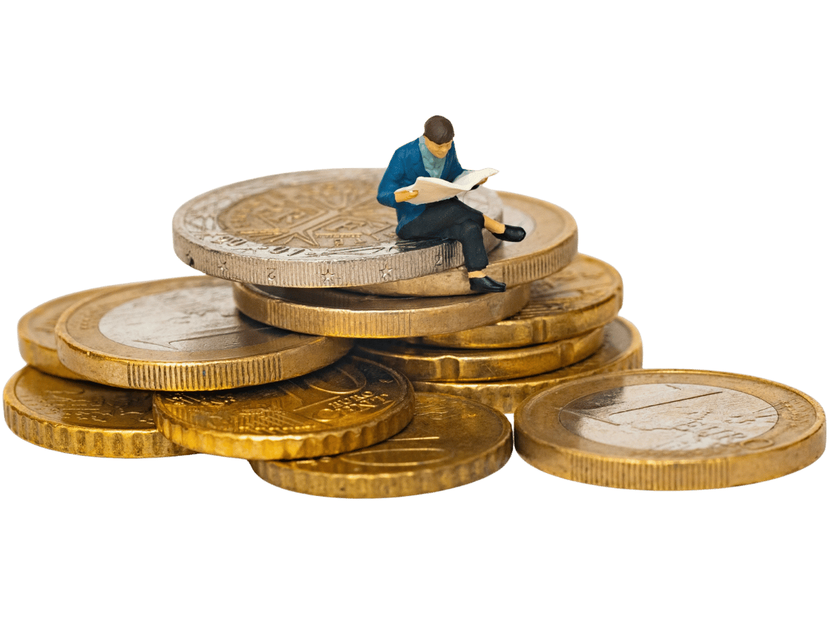 Person reading a book while sitting on gold coins